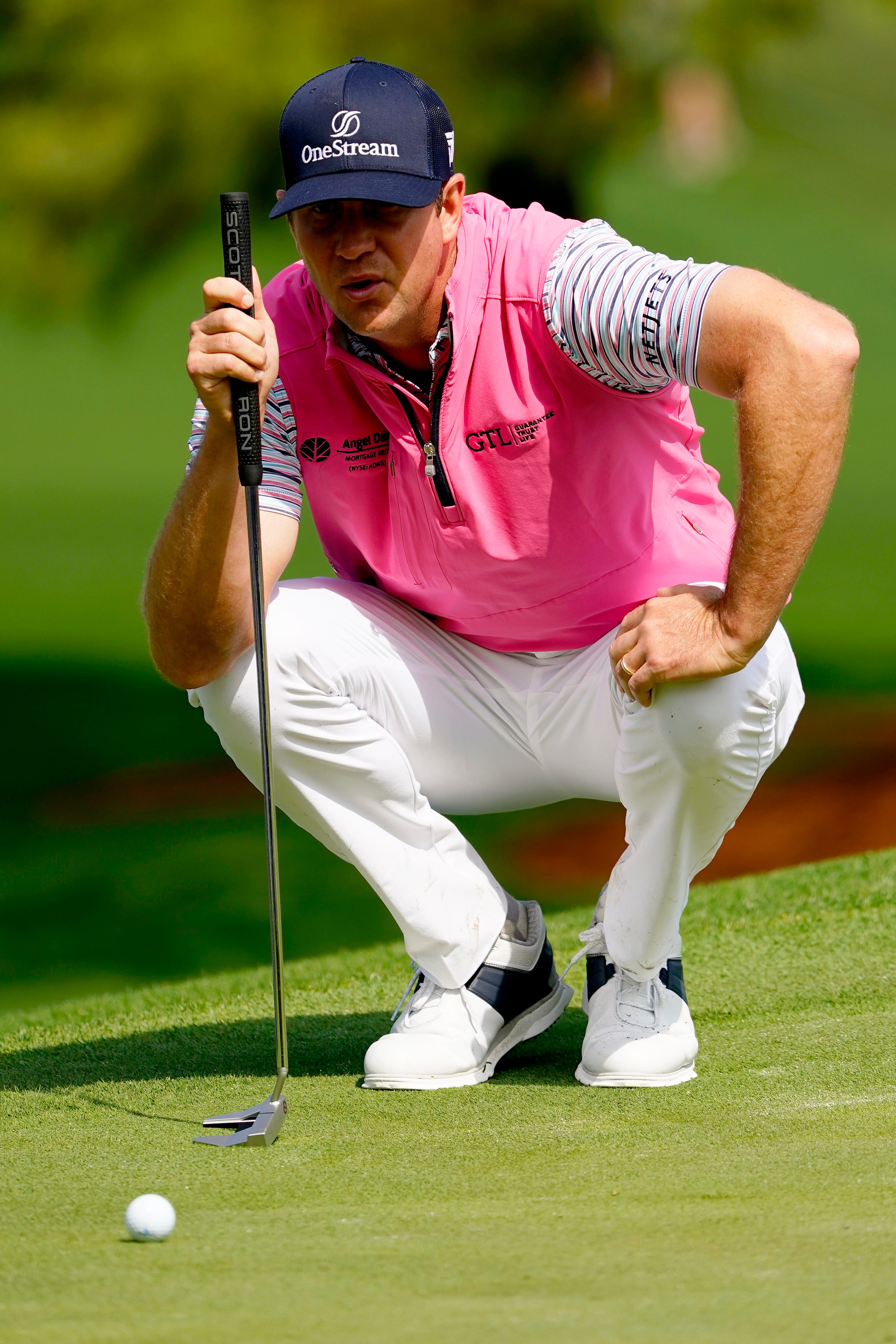 Apr 7, 2022; Augusta, Georgia, USA; Hudson Swafford lines up his putt on the no. 7 green during the first round of The Masters golf tournament at Augusta National Golf Club. Mandatory Credit: Andrew Davis Tucker-Augusta Chronicle/USA TODAY Sports