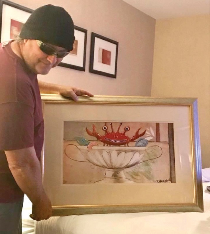 T Bang with one of his works of art.