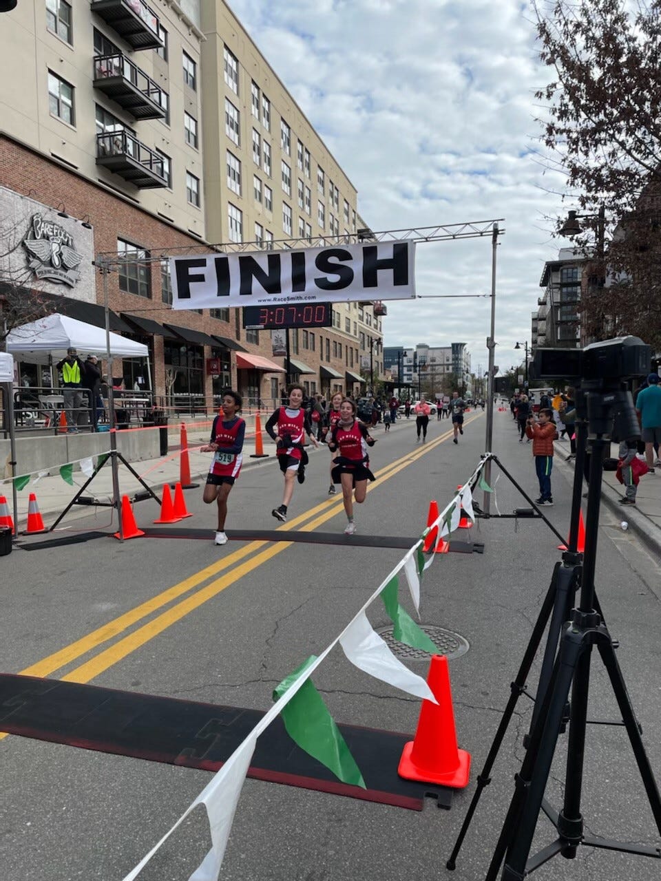 Runners cross the finish line at the Tallahassee Marathon on Feb. 6, 2022.