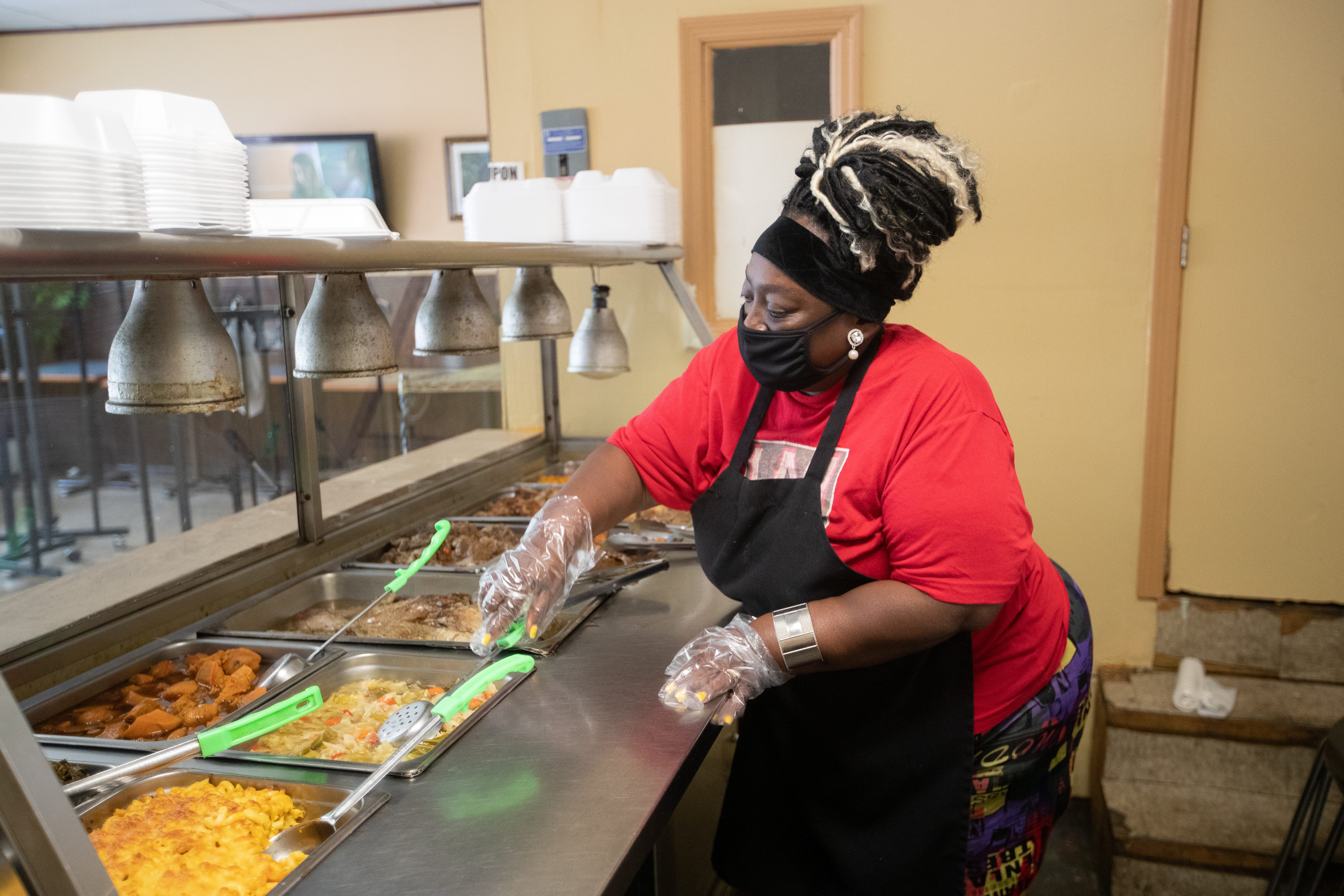 Vanessa Collins, owner of Auntie's Kitchen, will be preparing her lunch line on Thursday, August 20, 2020. Collin said she saw a 70% decrease in pedestrian traffic at the South Adams Street soul food eatery in the past five months.