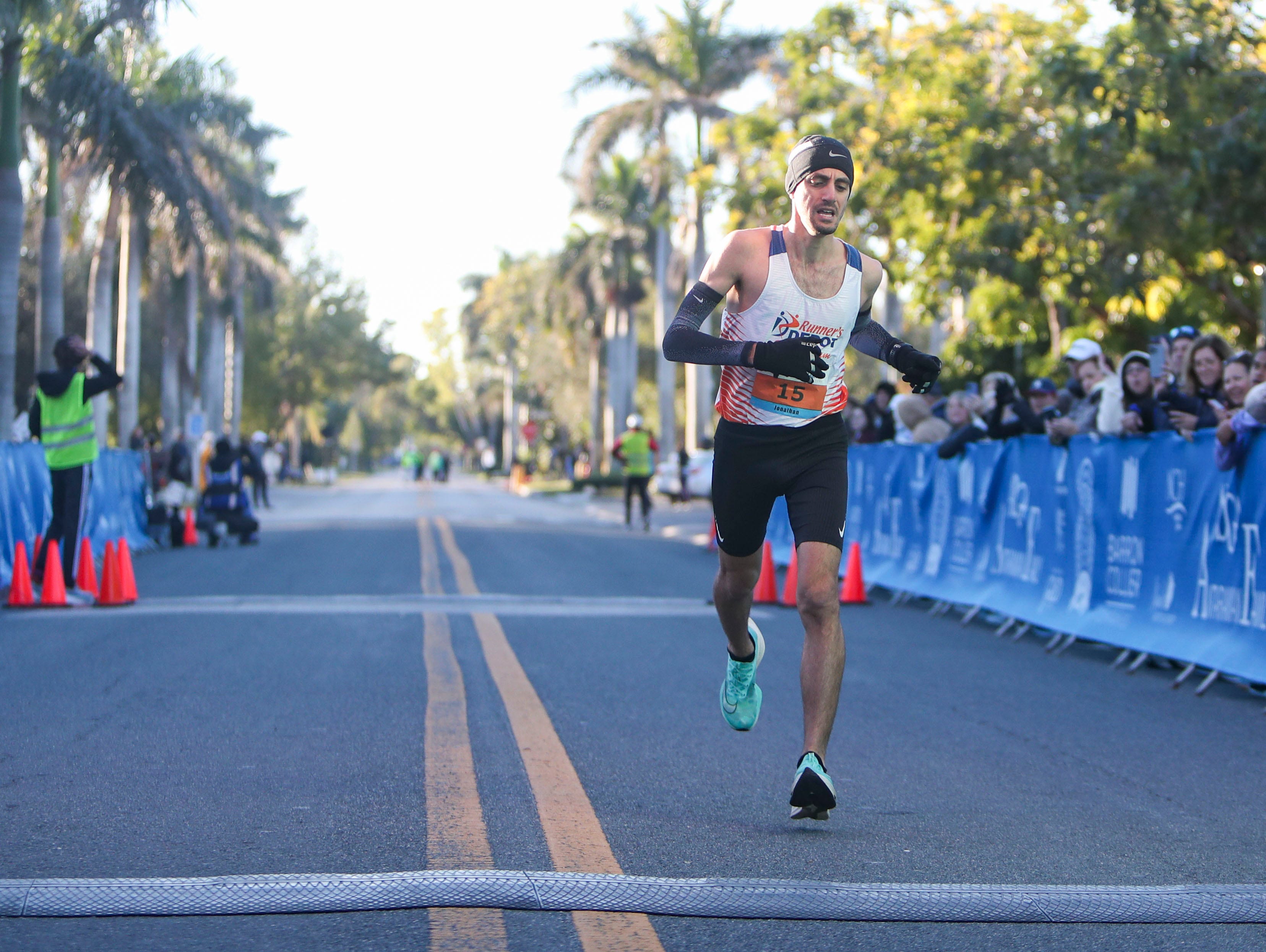 Jonathan Werble of Weston finishes second during the Barron Collier Companies Naples Half Marathon in Naples on Sunday, Jan. 15, 2023.