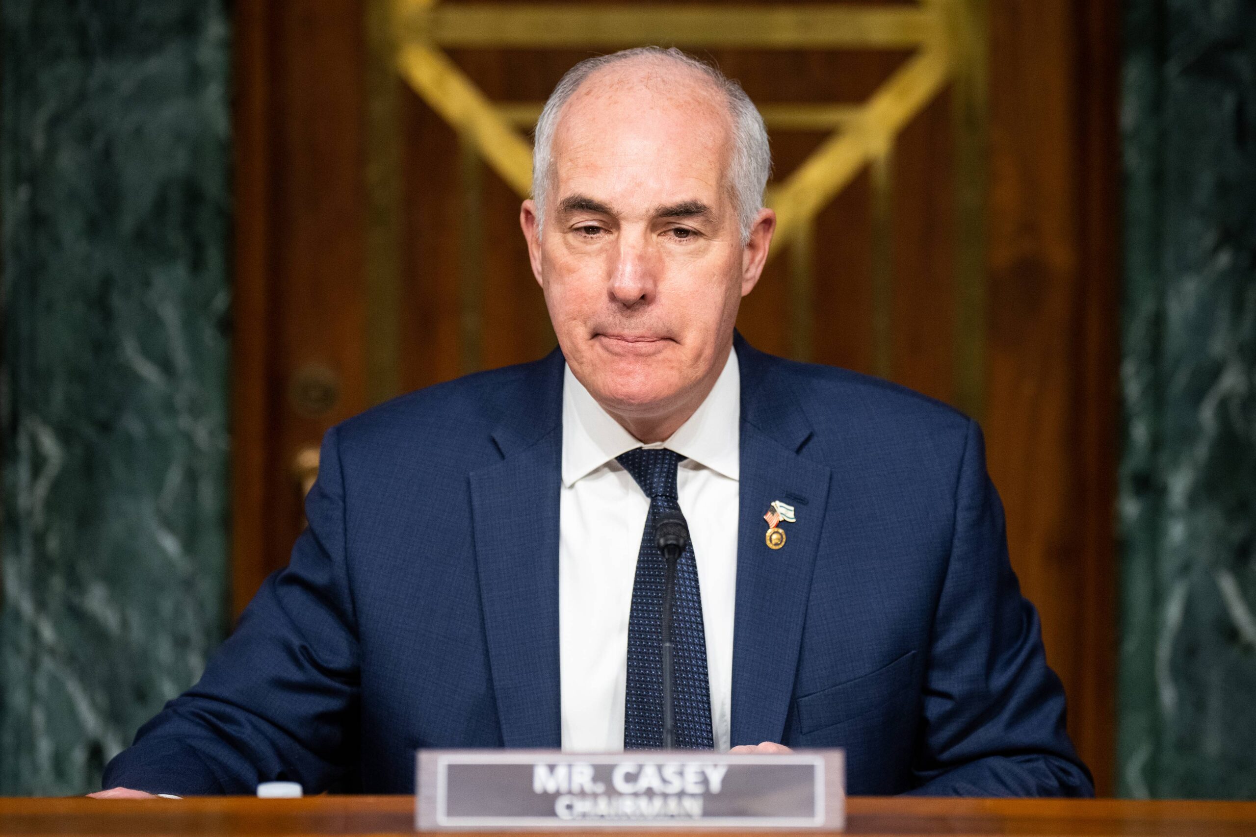 A photo of Senator Bob Casey sitting during a Senate committee hearing.