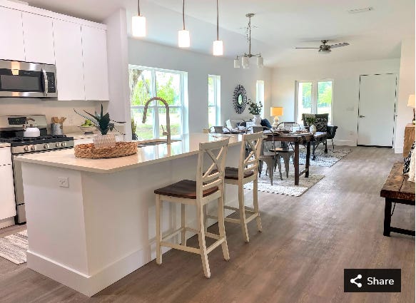 The kitchen, dining and living areas of the Red Maple model home at the Heartwood Subdivision, 1717 SE Eighth Ave., in Gainesville.  The neighborhood will have 34 lots when completed, 11 of which will be exclusively used for affordable housing.