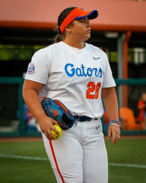 Florida Gators' right handed pitcher Marissa Mesiemore (28) returns to the dug out from the bull pen as the gators play the University of South Florida Bulls on April 20, 2022 at Katie Seashole Pressly Softball Stadium in Gainesville, Florida.  Gators won 1-0. [Gabriella Whisler/Special to the Sun]