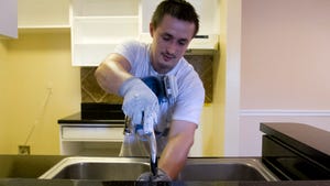 A faucet is put back together during work in an apartment in Fort Myers.